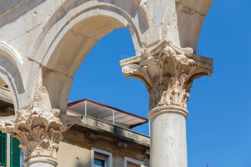 an archway in front of a building at PLR Luxury Rooms in Split