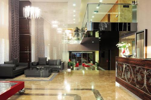 a lobby with couches and chairs in a building at Demora Hotel in Ankara