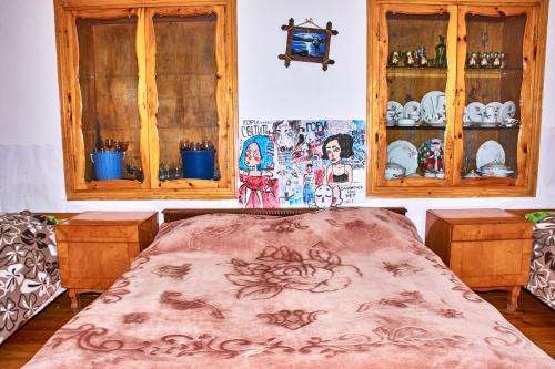 A bed or beds in a room at Guest House Svetlana