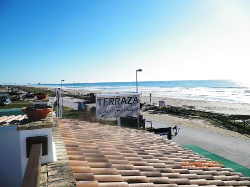 a sign for a therapy center at the beach at Casa Francisco el de Siempre in El Palmar