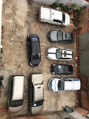 a group of cars parked in a parking lot at Hotel An Nhien in Buon Ma Thuot
