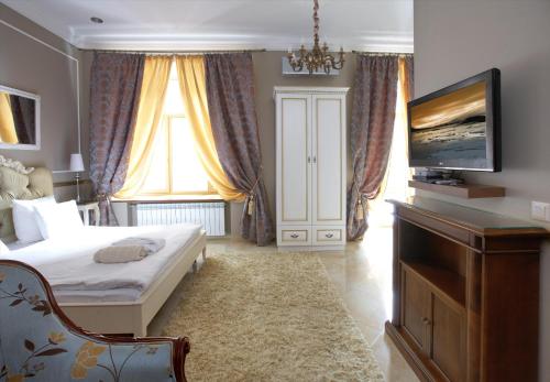 Letto o letti in una camera di Theatre Boutique Apartments