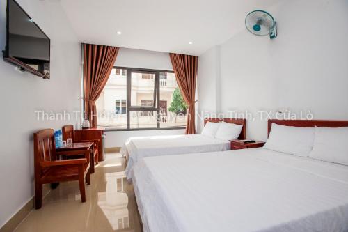 Giường trong phòng chung tại Thanh Tu Hotel