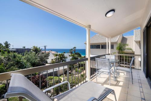 a view from the balcony of a house overlooking the ocean at Sunseeker Holiday Apartments in Sunshine Beach