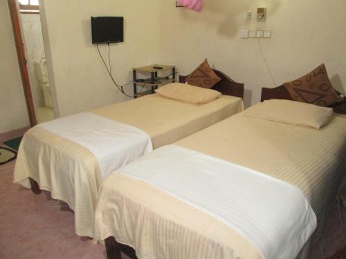 Una cama o camas en una habitación de Hotel Surasa