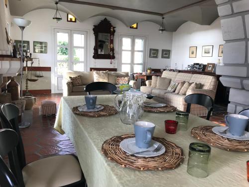 a living room with a table with dishes on it at Vrontados Villa in Vrontados