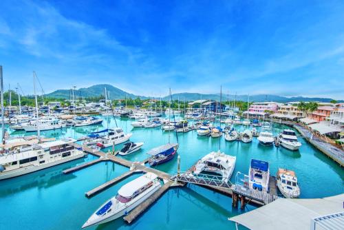 a bunch of boats docked in a marina at NH Boat Lagoon Phuket Resort in Phuket