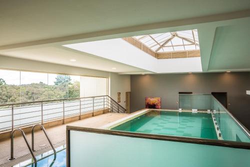 a large indoor swimming pool in a house at Executive Residency by Best Western Nairobi in Nairobi