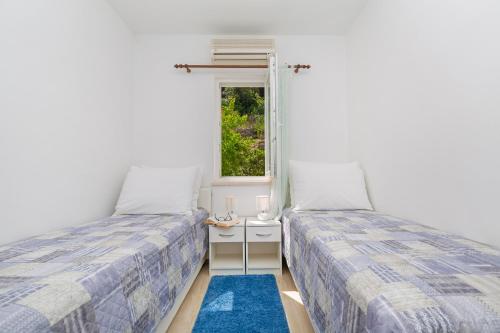 Un pat sau paturi într-o cameră la Apartments Elica