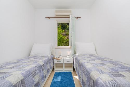 Postel nebo postele na pokoji v ubytování Apartments Elica