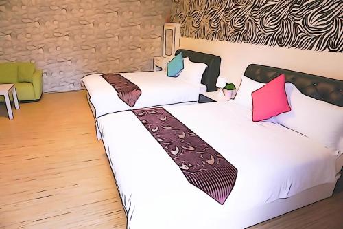 Una cama o camas en una habitación de Donggang Hai-Wan Homestay