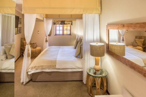 A bed or beds in a room at Constantia Hotel and Conference Centre