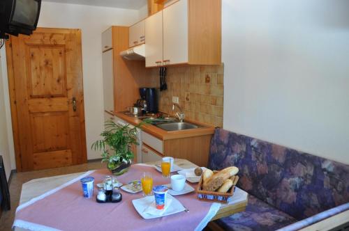 a kitchen with a table with food on it at Alpenspirit in Sölden