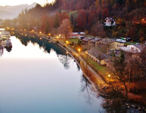a view of a river with a town and street lights at The River Village in Interlaken