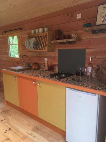 a kitchen with a stove and a counter top at Coutillard in Parisot-Tarn-et-Garonne