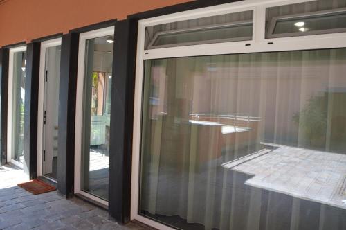 a room with sliding glass doors on a house at Casa delle mimose in Varazze