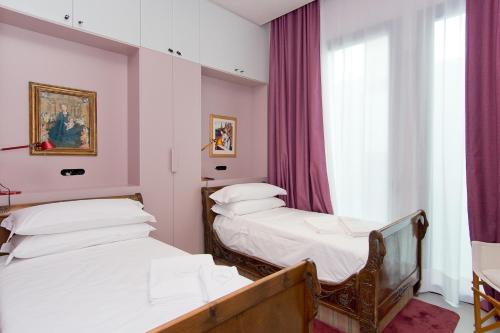 Łóżko lub łóżka w pokoju w obiekcie Amor de Dios 17 Boutique Apartments