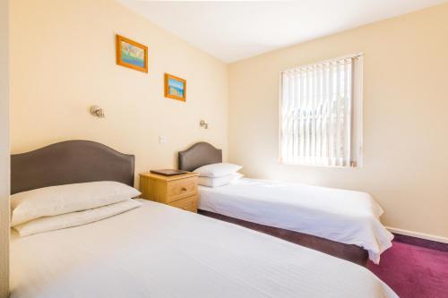 Ένα ή περισσότερα κρεβάτια σε δωμάτιο στο Marton Guest House