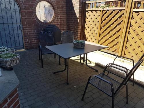 a table and chairs sitting on a patio at FeWo-Nordwalde in Nordwalde