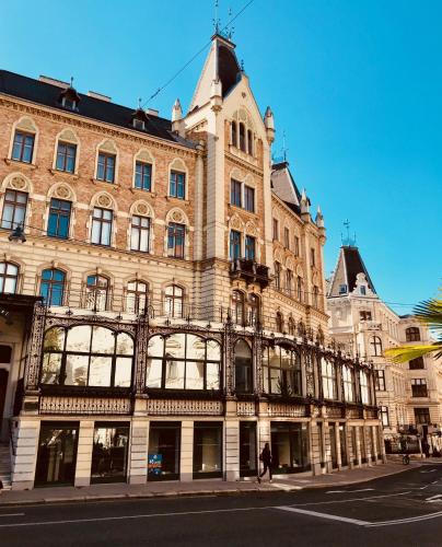 a large building on the side of a street at Best Place Apartments Vienna in Vienna
