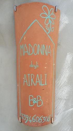 a sign that says madonna del anal anal bc at B&B Madonna degli Airali in Vezza d'Alba