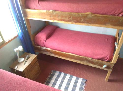 Postel nebo postele na pokoji v ubytování Piuke Mapu Patagonia Hostel