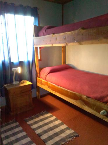 Postel nebo postele na pokoji v ubytování Piuke Mapu Patagonia Hostel
