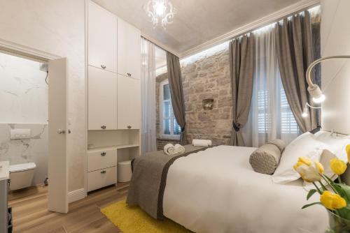 Giường trong phòng chung tại Zara Palace - design rooms