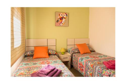 Cama o camas de una habitación en Apartamentos Mayoral