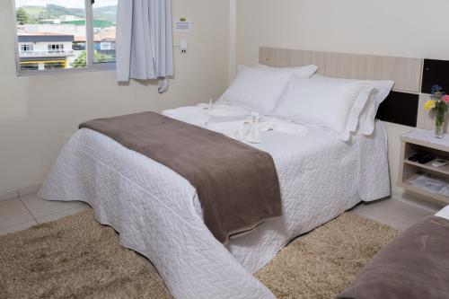 Postel nebo postele na pokoji v ubytování Hotel Scoz