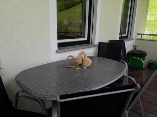 a table with a pair of sandals sitting on it at Appartement Ronacher in Mittersill