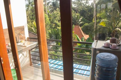 a view from the balcony of a house at Ratna Villa 4 in Ubud