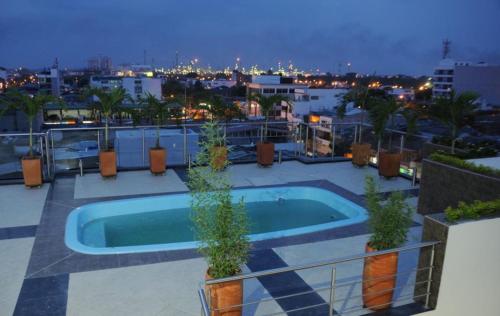 a swimming pool on the roof of a building at Hotel Bachue in Barrancabermeja