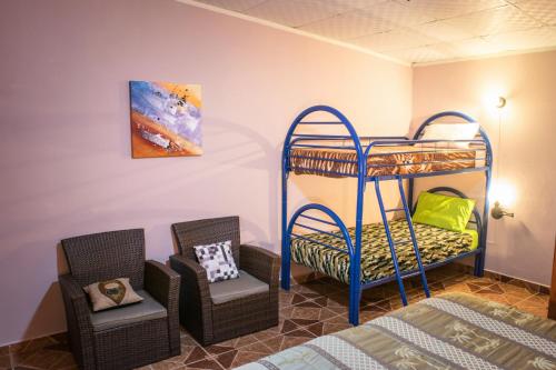 Postel nebo postele na pokoji v ubytování Agaseke Lodge Boquete