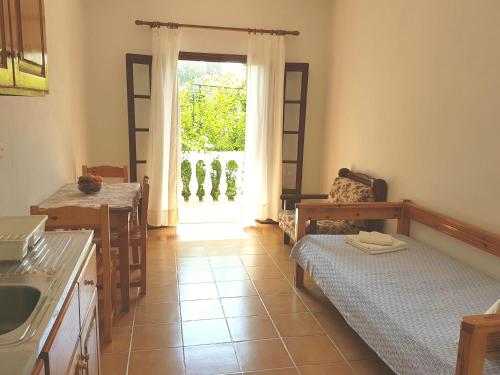 A bed or beds in a room at Alexandros Studios