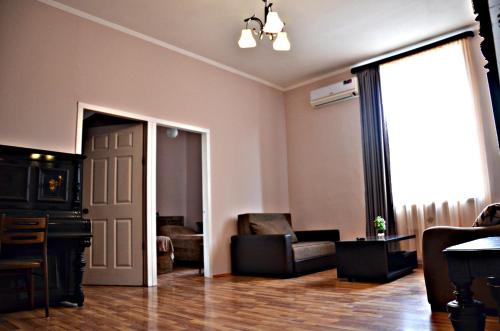 a living room with a door open to a living room at Giansa in Tbilisi City