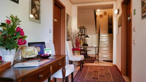 a home office with a desk and a chair at La Meridiana Affittacamere in Colorno