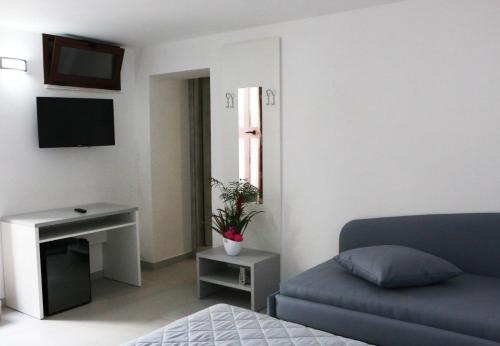 TV a/nebo společenská místnost v ubytování B&B Dolce Idea