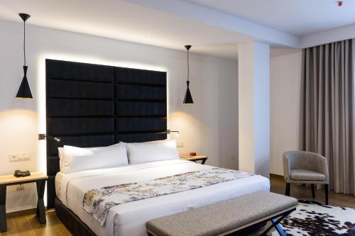 Posteľ alebo postele v izbe v ubytovaní Ceiba Hotel Bissau