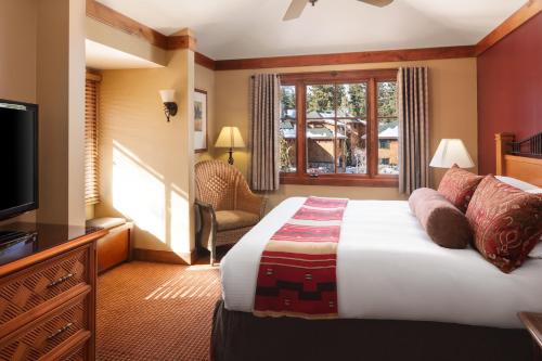 a hotel room with a bed and a television at Hyatt Vacation Club at High Sierra Lodge in Incline Village
