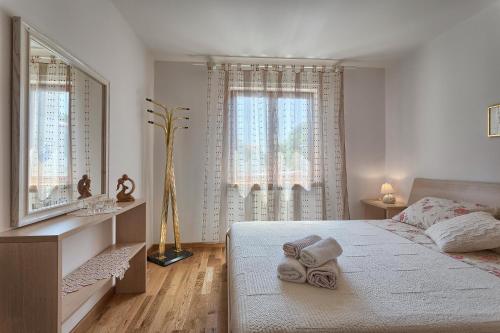 Postel nebo postele na pokoji v ubytování Apartments Vlasta