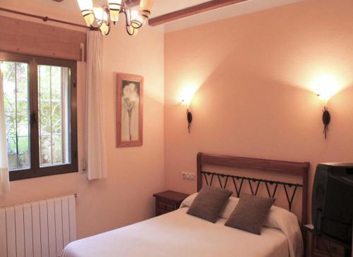 Ένα ή περισσότερα κρεβάτια σε δωμάτιο στο Apartamentos Monasterio
