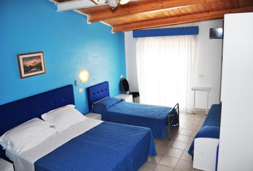 Postel nebo postele na pokoji v ubytování Hotel Albatros