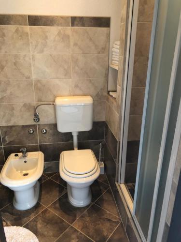 a bathroom with a toilet and a sink at Apartments Ivanković in Stari Grad