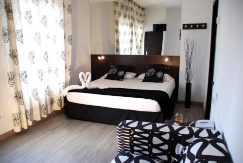 Un pat sau paturi într-o cameră la Hotel Casita Amarilla