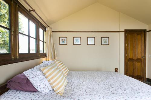a bedroom with a bed with two pillows on it at Casitas Las Uvas y las Viñas in Los Realejos