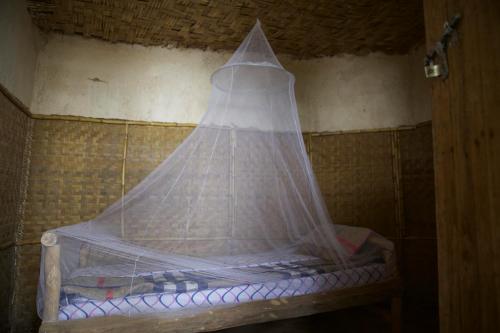 A bed or beds in a room at Mbunga Community Tourism Campsite
