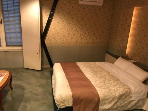 Ένα ή περισσότερα κρεβάτια σε δωμάτιο στο Hotel Tiffany (Adult Only)