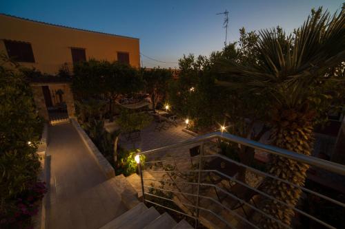 a view of a garden at night with lights at Amaka in Custonaci