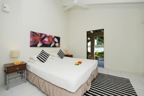 A bed or beds in a room at Erakor Island Resort & Spa